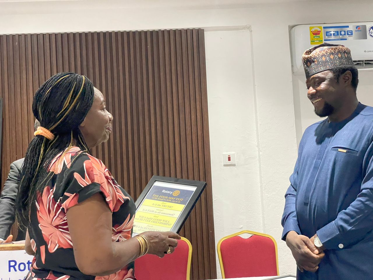 Presentation of a plaque to a GC Brothers representative at a Rotary event