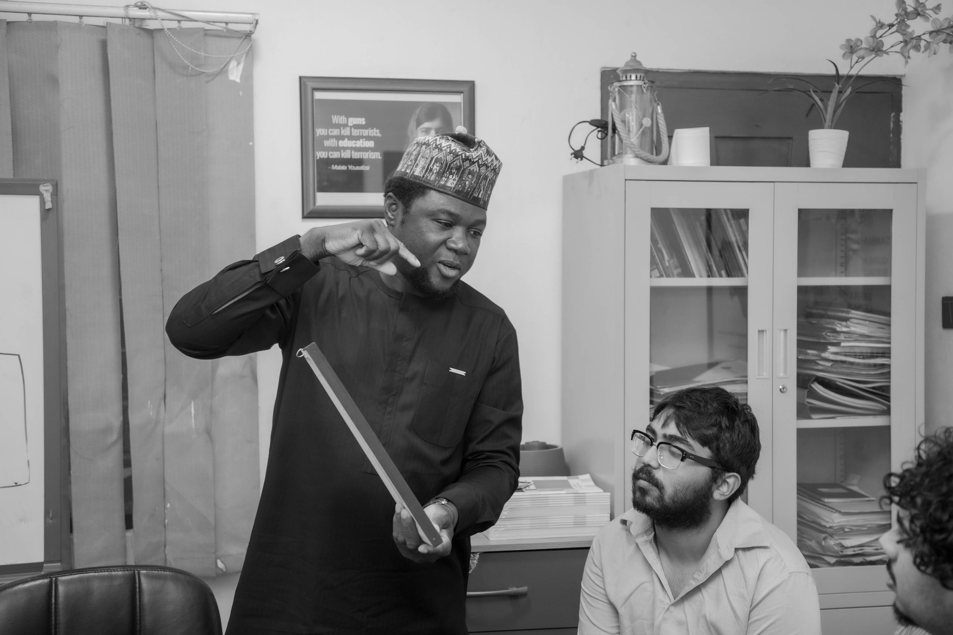 GC Brothers leading a discussion session with team members in the office